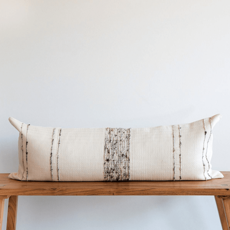 Bogota Lumbar Pillow - Ivory Cotton with grey wool stripes styled on wood bench