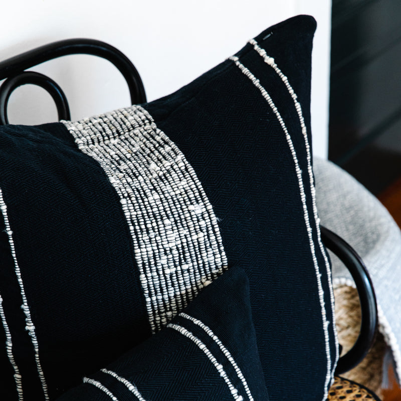 Azulina Home - Bogota Pillow - Black Cotton with Ivory Wool Stripes.  Stripes across the pure cotton twill base create a clean-lined and versatile pattern that celebrates the natural materials. 95% cotton and 5% virgin wool, locally sourced in Colombia.