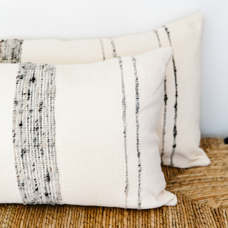 Azulina Home - Bogota small lumbar pillow - ivory cotton with grey wool stripes.  Stripes across the pure cotton twill base create a clean-lined and versatile pattern that celebrates the natural materials. 95% cotton and 5% virgin wool, locally sourced in Colombia. 